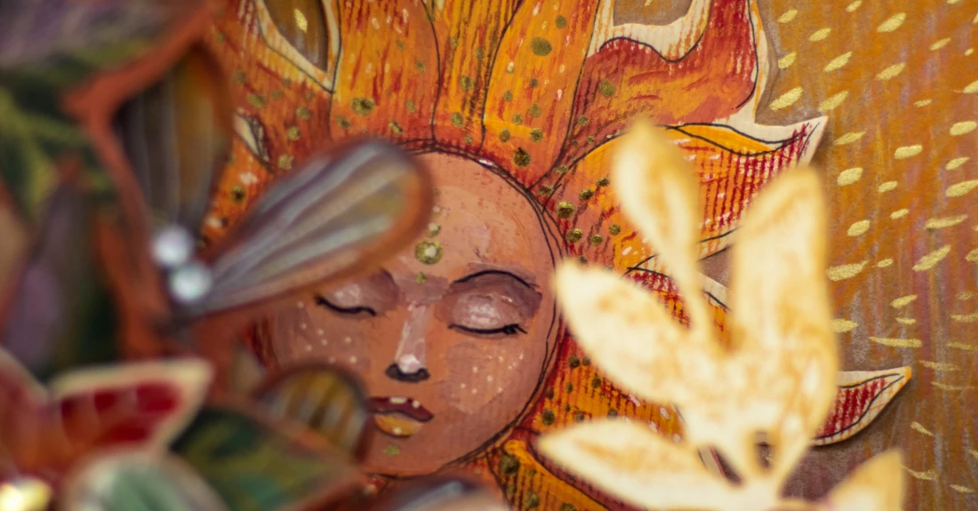 Close up of a painting of a sunflower, photo by Elena Mozhvilo