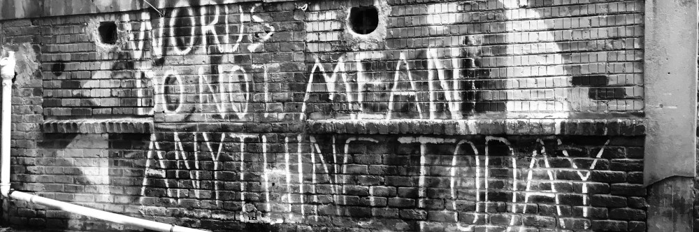 Any Day Now by Barlow Crassmont A brick wall with graffiti, photo by Hennie Stander