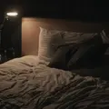 A bed in a bedroom, photo by JP Valery