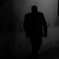 Silhouette of a man walking at night, photo by Rene Bohmer