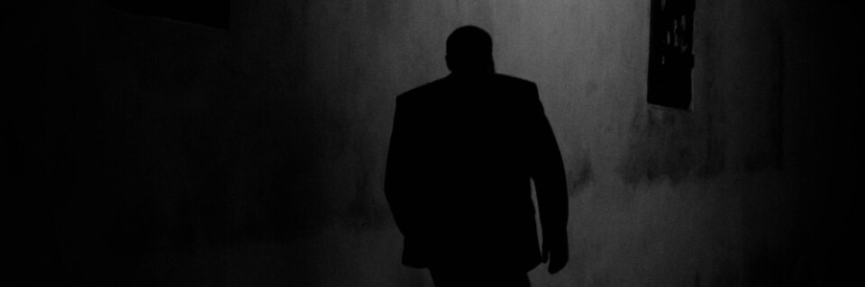 Silhouette of a man walking at night, photo by Rene Bohmer