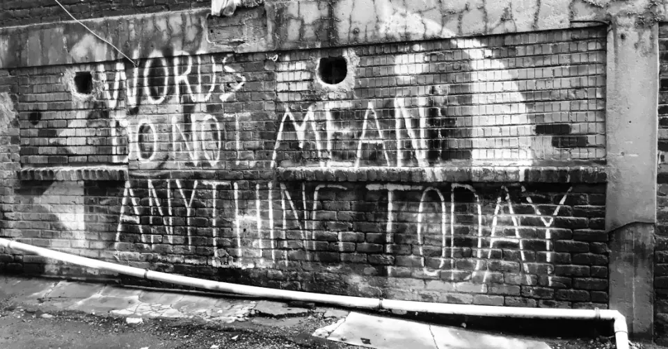 A brick wall with graffiti, photo by Hennie Stander