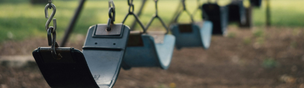 Playground swings, photo by Aaron Burden